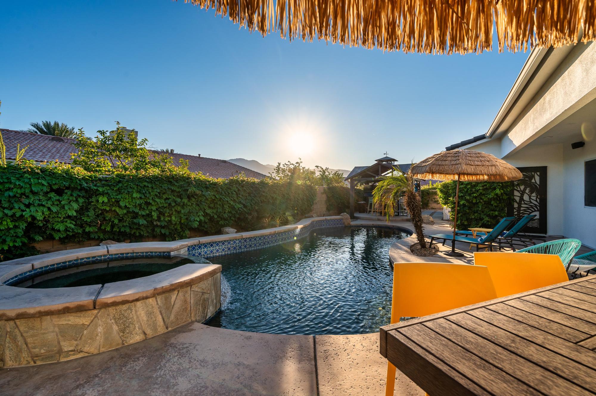 Desert sun over the heated saltwater pool and stone spa